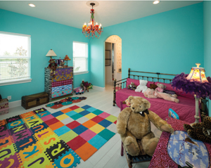 Now grandparents with four grandchildren, Susie, or “Glitzy,” as the grandchildren call her, designed a room where the kids can play and visit. Photo by Steve Chenn.