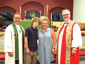 Father Mike Bessom, James Edward and Alisa Murray and Bishop Andy Doyle.