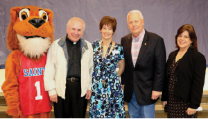 School Mascot Leo the Lion, Father Drew Wood, Suzanne Barto, James Thompson and Germaine Guedry.
